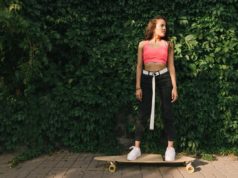 Do You Want To Start Longboarding? Here Are Some Tips standing on a longboard